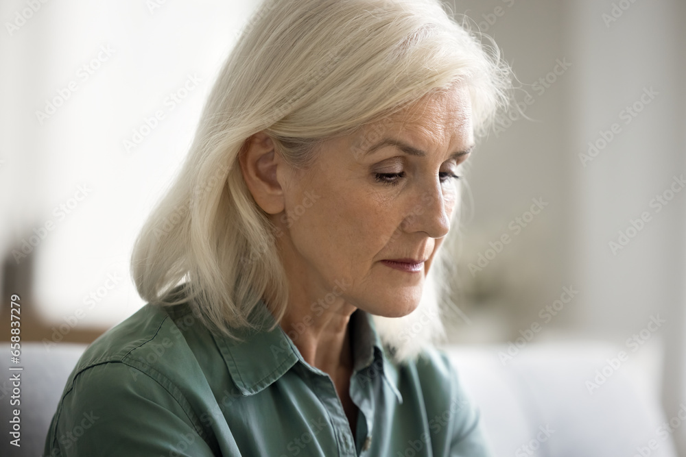 Sad lost blonde elderly lady staring into vacancy, going through loss, grief, depression, bad mental health problems, looking depressed, desperate, frustrated Sad lost blonde elderly lady staring into vacancy, going through loss, grief, depression, bad mental health problems, looking depressed, desperate, frustrated
