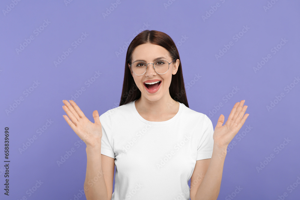 Portrait of emotional woman in stylish eyeglasses on violet background Portrait of emotional woman in stylish eyeglasses on violet background