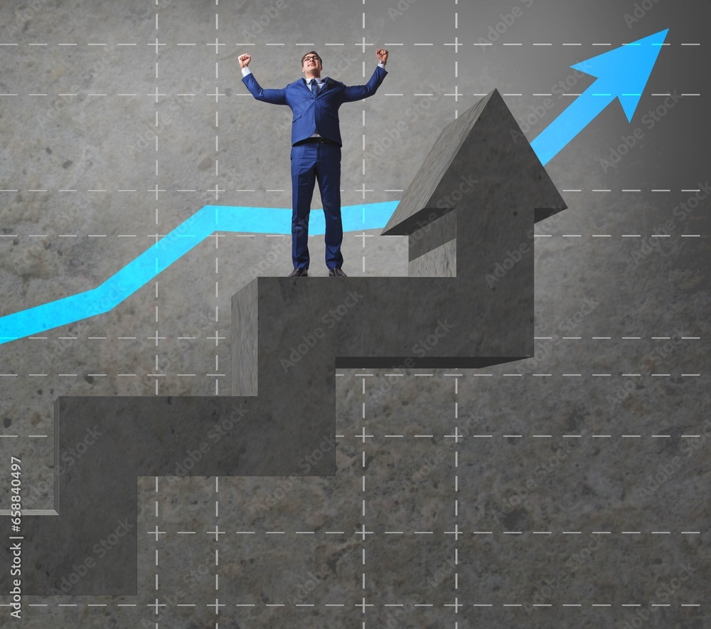 Young businessman climbing career ladder Young businessman climbing career ladder