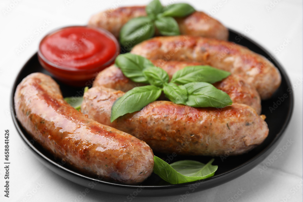 Plate with tasty homemade sausages, ketchup and basil leaves on white table, closeup Plate with tasty homemade sausages, ketchup and basil leaves on white table, closeup