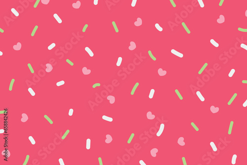 Colorful sprinkles on pink background
