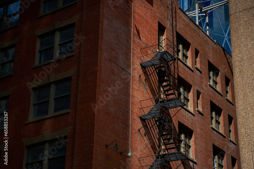 Old fire escape on an old brick wall. American vintage style.