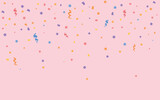 Many falling confetti on pink background