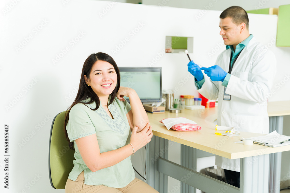 Female patient in the medical lab for a blood sample