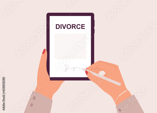 Female’s Hand Holding Tablet While Signing An Online Divorce Decree With Stylus Pen. Close-Up.