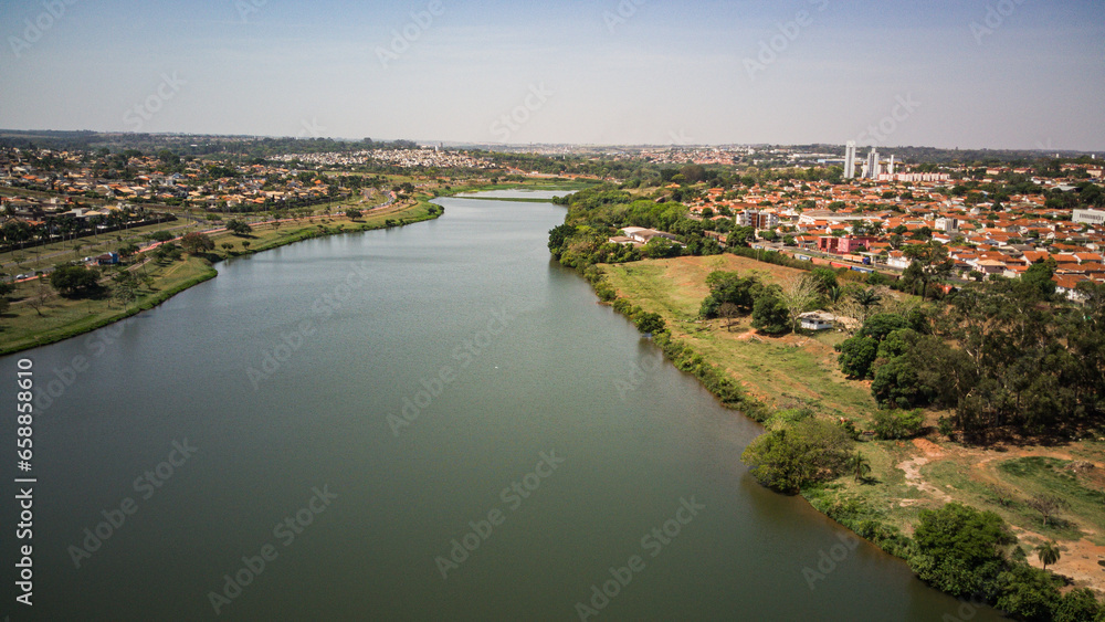 Aerial view of the Rio Preto municipal dam in drone panorama, aerial view on a sunny day with the avenues and highways and the park and the river in high resolution - Sao Jose do Rio Preto - Sao Paulo