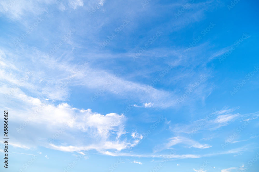 Blue sky and white fluffy tiny clouds background and pattern