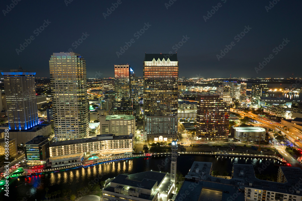 Aerial view of downtown district of Tampa city in Florida, USA. Brightly illuminated high skyscraper buildings in modern american midtown