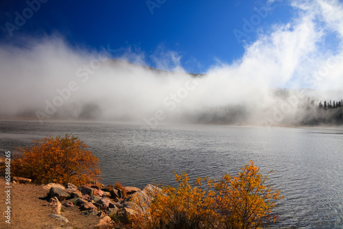 Scenic Echo lake on Mt. Evans summit covered with clouds.