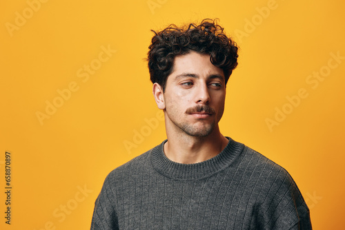 Man background portrait hand hispanic smile orange sweater student fashion happy trendy beard