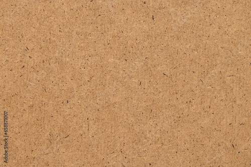 Background, photo texture of wood fiber board, a yellow building material.