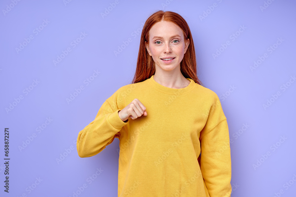 Young deaf mute cheerful woman teaching how to speak sign language, closeup portrait isolated blue background studio shot Alphabet - letter A spelling by man's hand in American Sign Language (ASL) Young deaf mute cheerful woman teaching how to speak sign language, closeup portrait isolated blue background studio shot Alphabet - letter A spelling by man's hand in American Sign Language (ASL)