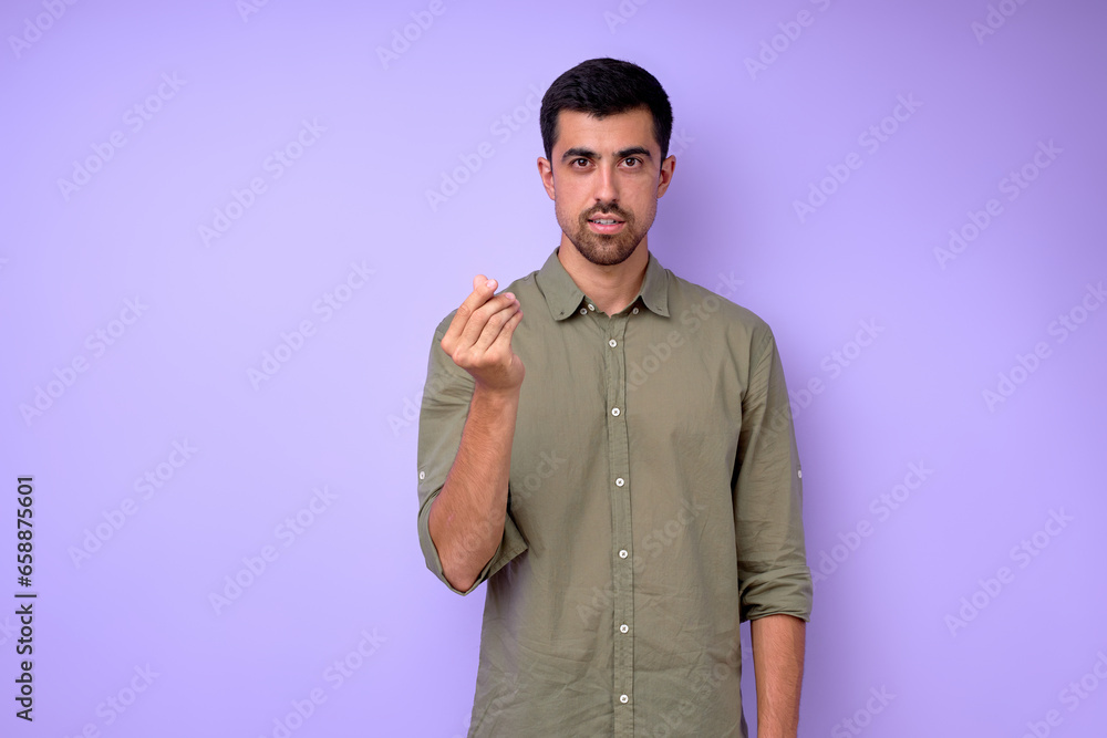 Young deaf mute man asking money using sign language on blue background, close up portrait isolated Young deaf mute man asking money using sign language on blue background, close up portrait isolated