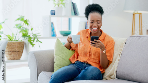 Coffee, woman and laugh with phone on sofa, reading social media post and mobile chat at home. Happy african person drinking tea, scroll multimedia connection and funny meme online with smartphone