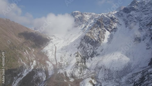 Wallpaper Mural Aerial shot between mountain peaks in the clouds Torontodigital.ca