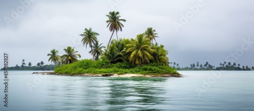 A palm forested motu in South Tarawa atoll Kiribati Micronesia during the wet rainy season With copyspace for text photo