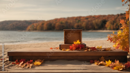 blank Autumn podium made of natural wood and autumn foliage on the wonderful beach background for product presentation.