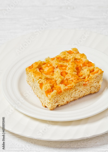 peach cake on white plate, top view