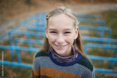 portrait of  laughing schoolgirl on the playground photo