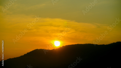 view of the morning sun, golden rays in the sky at sunrise