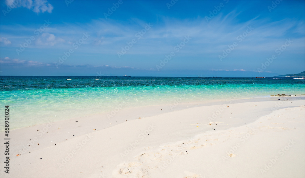 White sand beach, blue sea water, sunny weather