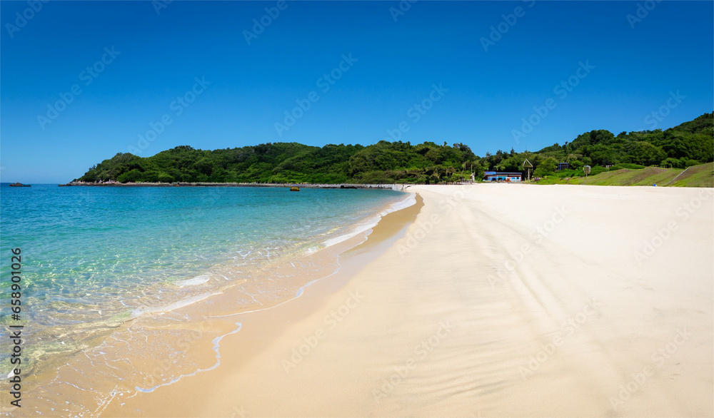 White sand beach, blue sea water, sunny weather