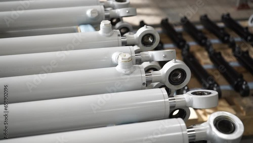 A mechanical device with hydraulic components. Hydraulic cylinders on stand exhibition