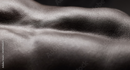 Fitness, man and muscle and closeup in studio for wellness, stomach and body on dark background. Person, torso and six pack with bodybuilder or guy and strength, topless and zoom or abdomen