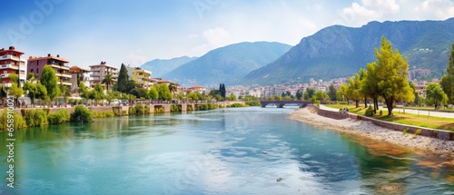 Scenic River Embankment and Park Area with Majestic Mountain Backdrop in Alanya, Turkey: Colorful Panoramic Landscape