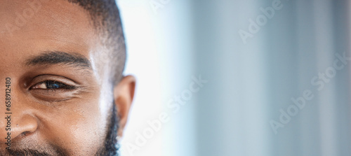 Half face, eye and a black man with mockup for cosmetics, skincare or glow. Banner, happy and a portrait of an African person with space for complexion or dermatology information with a smile