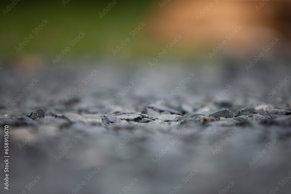 Obraz premium Close up of wet asphalt road with blurred background. Selective focus. 