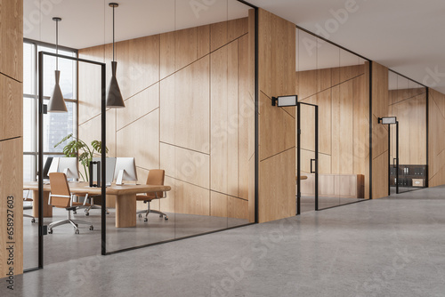 Foto Stylish glass workplace interior with pc desktop and panoramic window