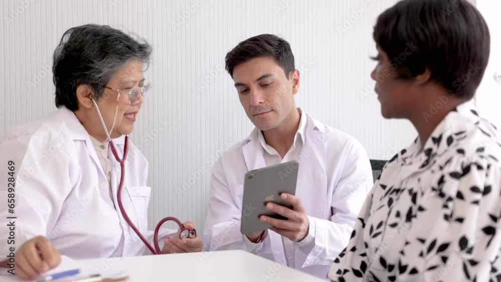 4K young Caucasian physician man consult Asian senior doctor 60s woman diagnose sickness disease patient African woman in hospital, female health care doctor visit checkup, medical professional team 4K young Caucasian physician man consult Asian senior doctor 60s woman diagnose sickness disease patient African woman in hospital, female health care doctor visit checkup, medical professional team