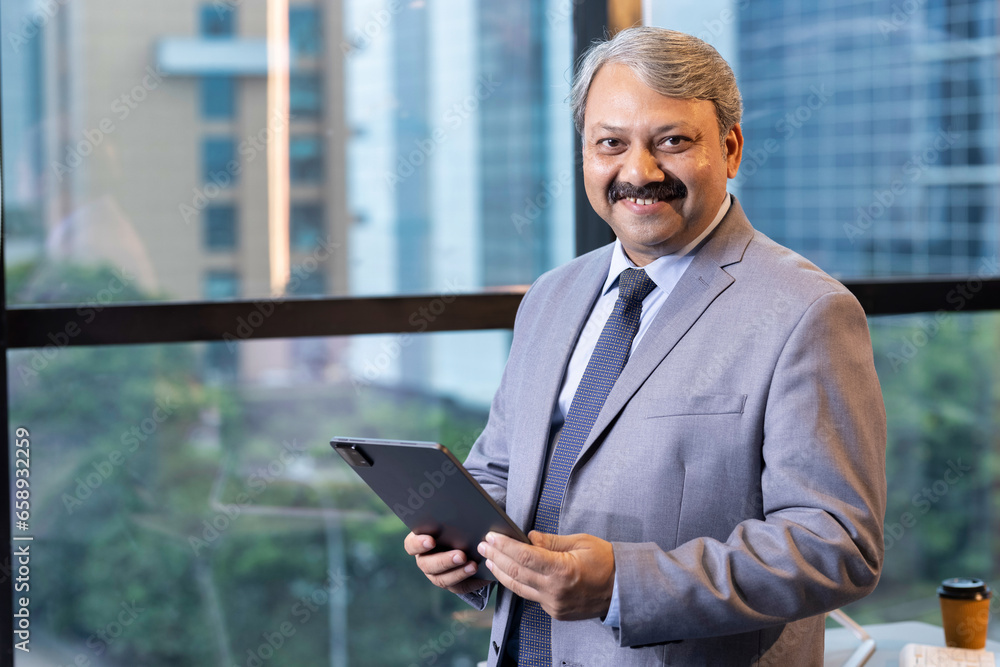 Businessman using digital tablet at office Businessman using digital tablet at office