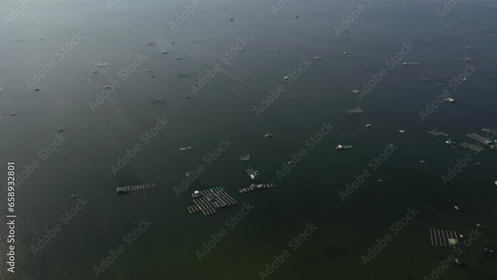 Cam Ranh bay aerial view with beautiful lagoon in turquoise colour and white boat, Lobster farm, flying over idyllic beach in Khanh Hoa, Vietnam Cam Ranh bay aerial view with beautiful lagoon in turquoise colour and white boat, Lobster farm, flying over idyllic beach in Khanh Hoa, Vietnam