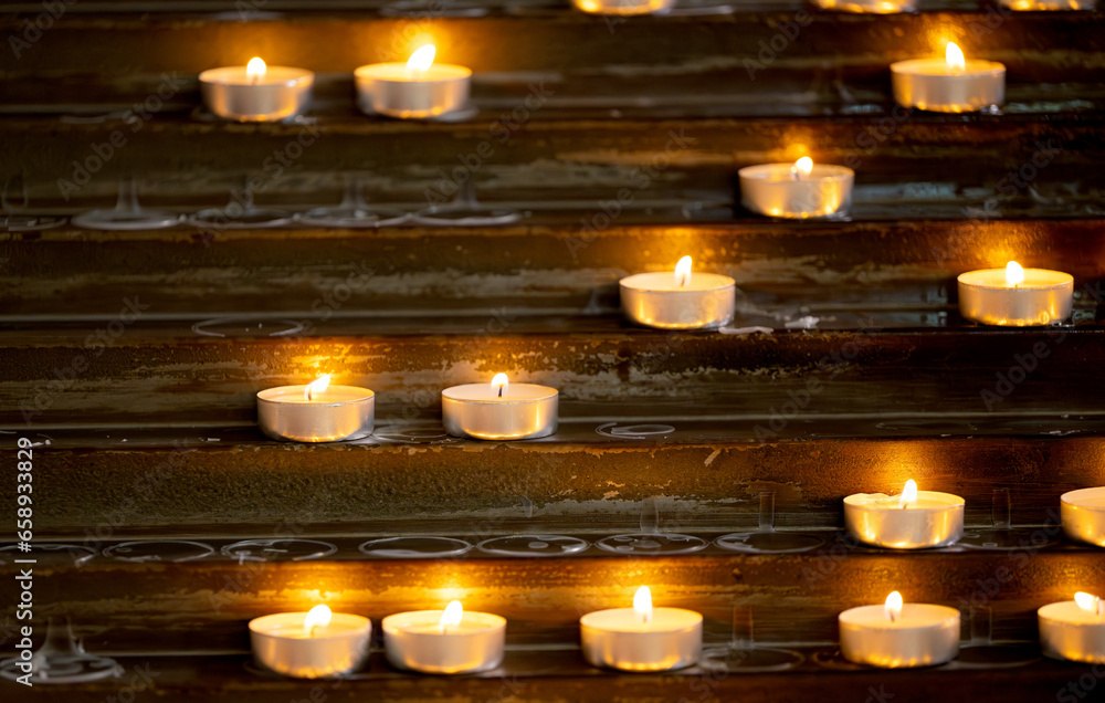 burning candles in a catholic church burning candles in a catholic church