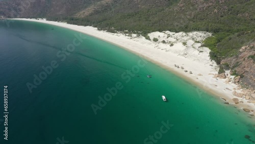 Con beach, aerial view with beautiful lagoon in turquoise colour and  white boat, Lobster farm, flying over idyllic beach in Binh Lap, Ninh Thuan, Vietnam