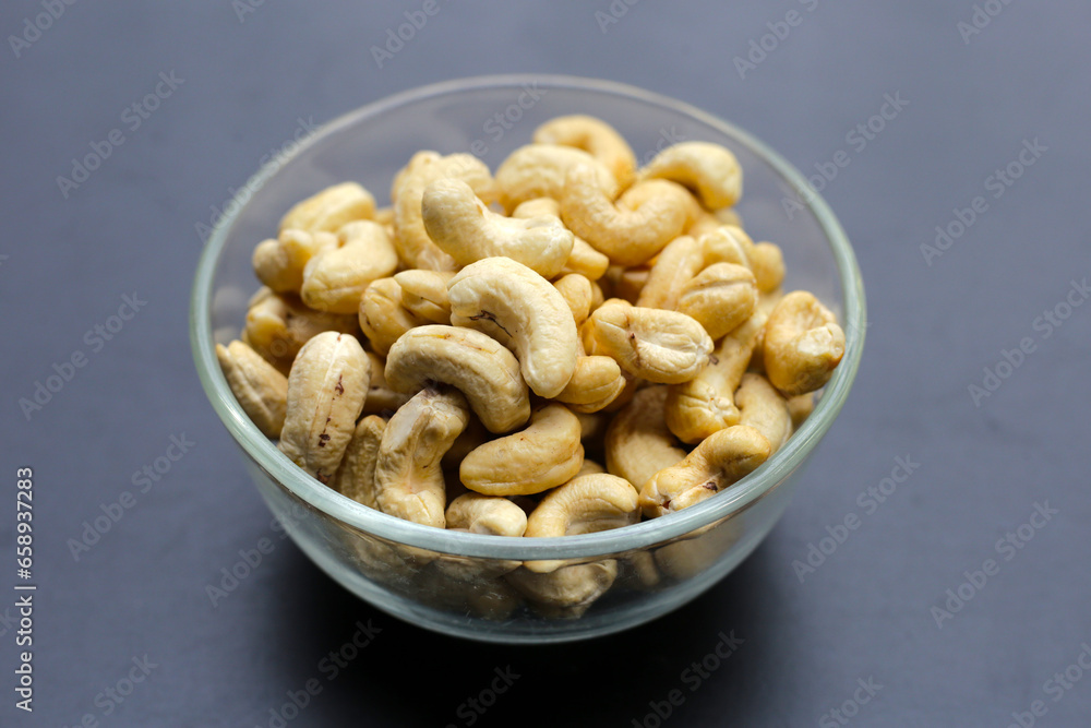 Cashew nuts on dark background. Cashew nuts on dark background.