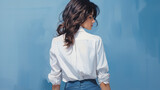Portrait of a woman, The back of young woman dressed in blue sexual blouse looking a side isolated on blue background, advertising sale banner promo concept, copy space