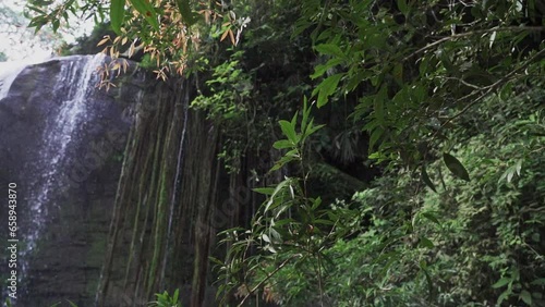 cascada la motilona, beautiful tropical waterfalls in the deep rainforest of the jungle near Paicol in Colombia cascading into a turquoise pool along the riverbed. photo