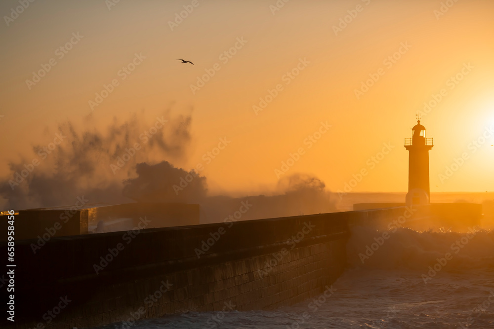 Big waves at Porto's lighthouse during an amazing sunset.
