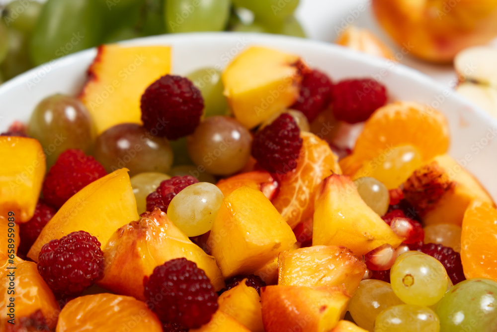 A healthy dessert is a fruit salad made from mixed raspberries, tangerines, grapes and nectarines. A healthy dessert is a fruit salad made from mixed raspberries, tangerines, grapes and nectarines.