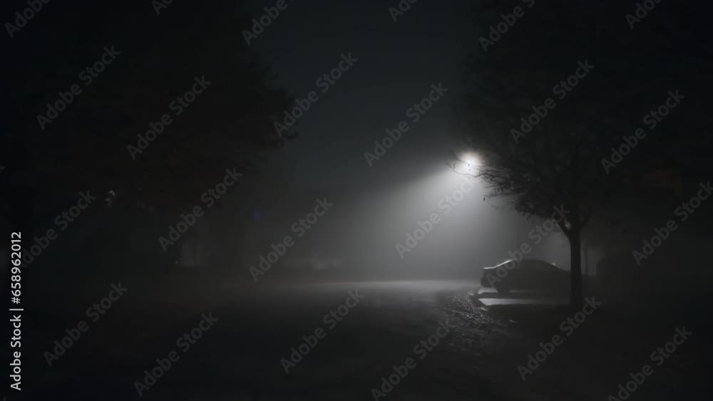 empty road of smoke and fog at night time in suburb. wide shot footage empty road of smoke and fog at night time in suburb. wide shot footage