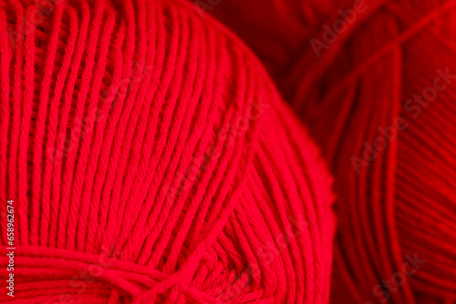 woolen threads of red color for knitting knitting close-up