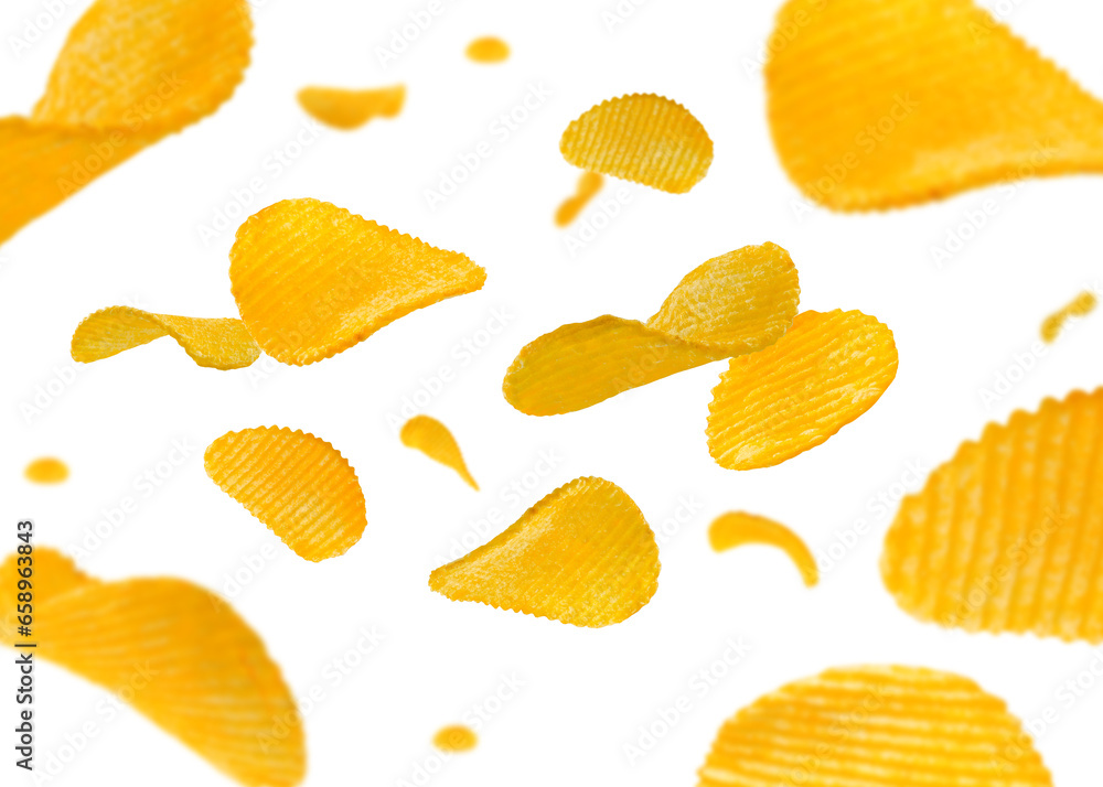 Ridged potato chips isolated on white fly and levitate in space. Selective focus Ridged potato chips isolated on white fly and levitate in space. Selective focus