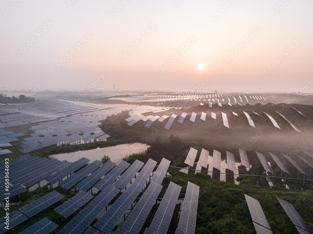aerial view solar power station on mountain with sunrise