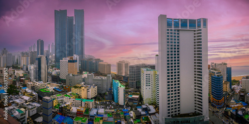Busan City panorama of the skyline, modern and rustic buildings with dramatic beautiful sunset and cloudscape over the Haeundae Beach ocean view in Kyongsang Namdo, South Korea