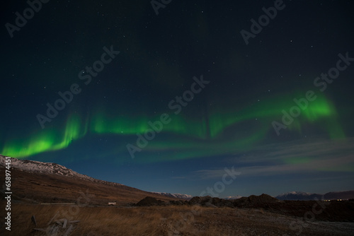 aurora borealis above the mountains
