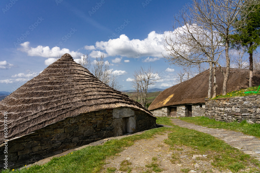 Traditional houses called pallozas with their thatched roofs in the beautiful village of O Cebreiro, which is a crossing point on the way of Santiago, Lugo.Spain Traditional houses called pallozas with their thatched roofs in the beautiful village of O Cebreiro, which is a crossing point on the way of Santiago, Lugo.Spain