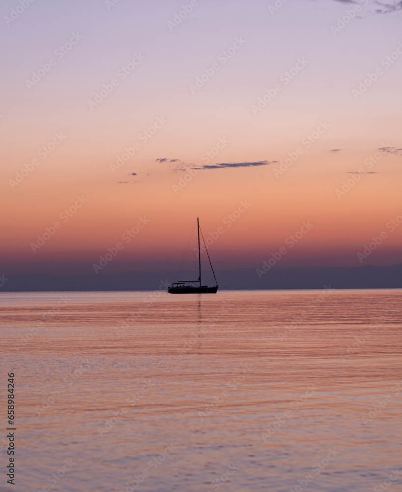 Random boat sailing during a beautiful sunset in Zadar, Croatia